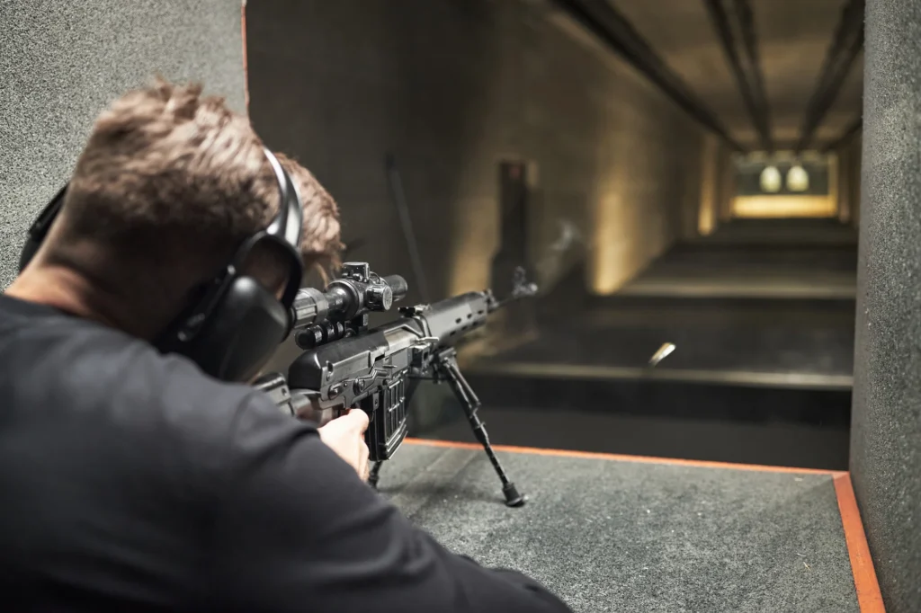 man practicing precision shooting at indoor gun ra 2026 03 20 04 02 22 utc